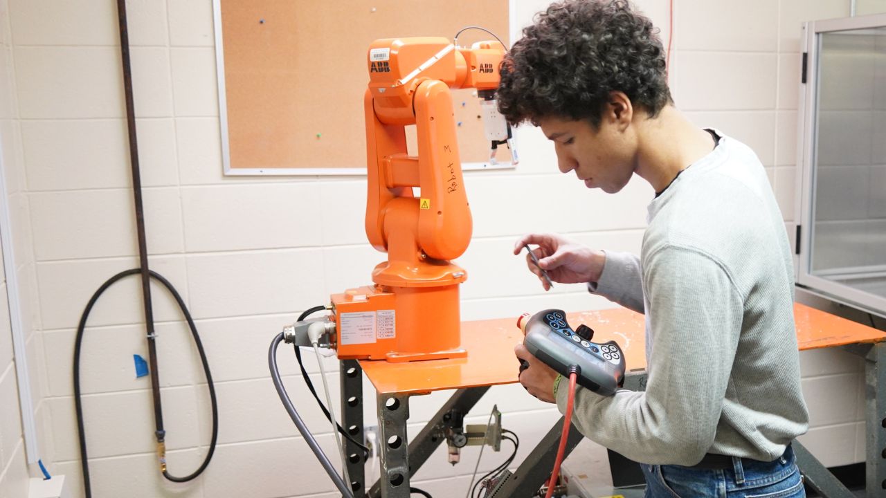 Student practicing with controllable robot in WVC classroom