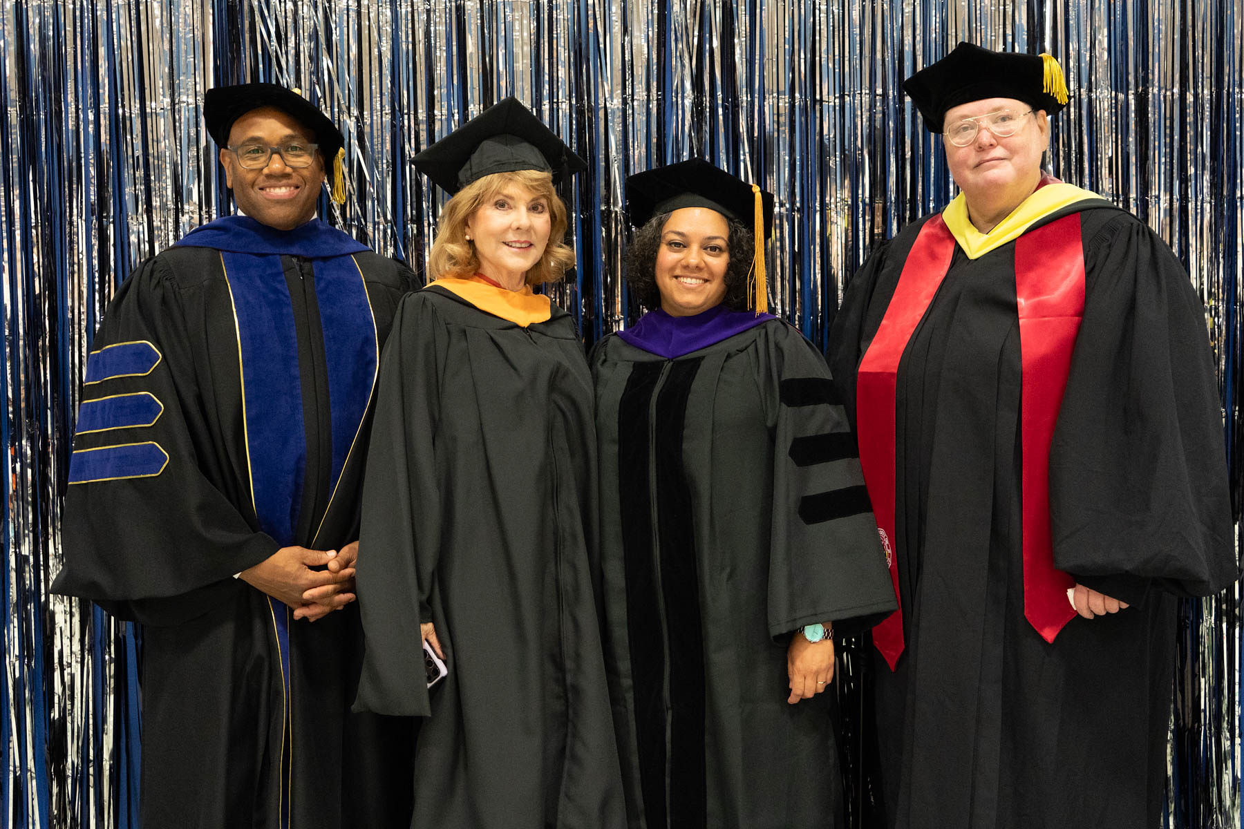 Photograph of trustees Phylicia Hancock Lewis and Paula Arno Martinez with President and Dean of Omak